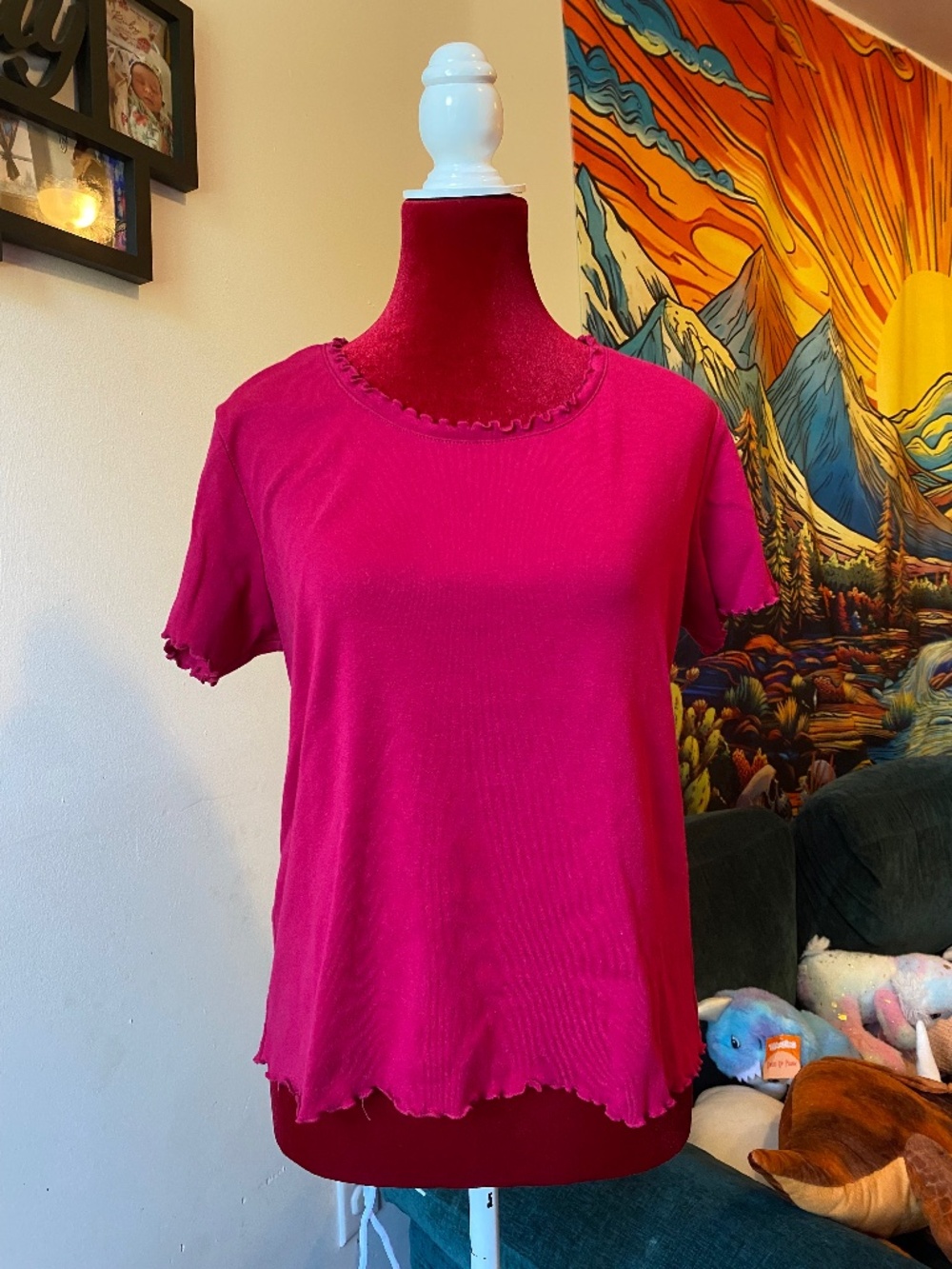 Pink short sleeve t-shirt with lettuce trim on neckline and hem